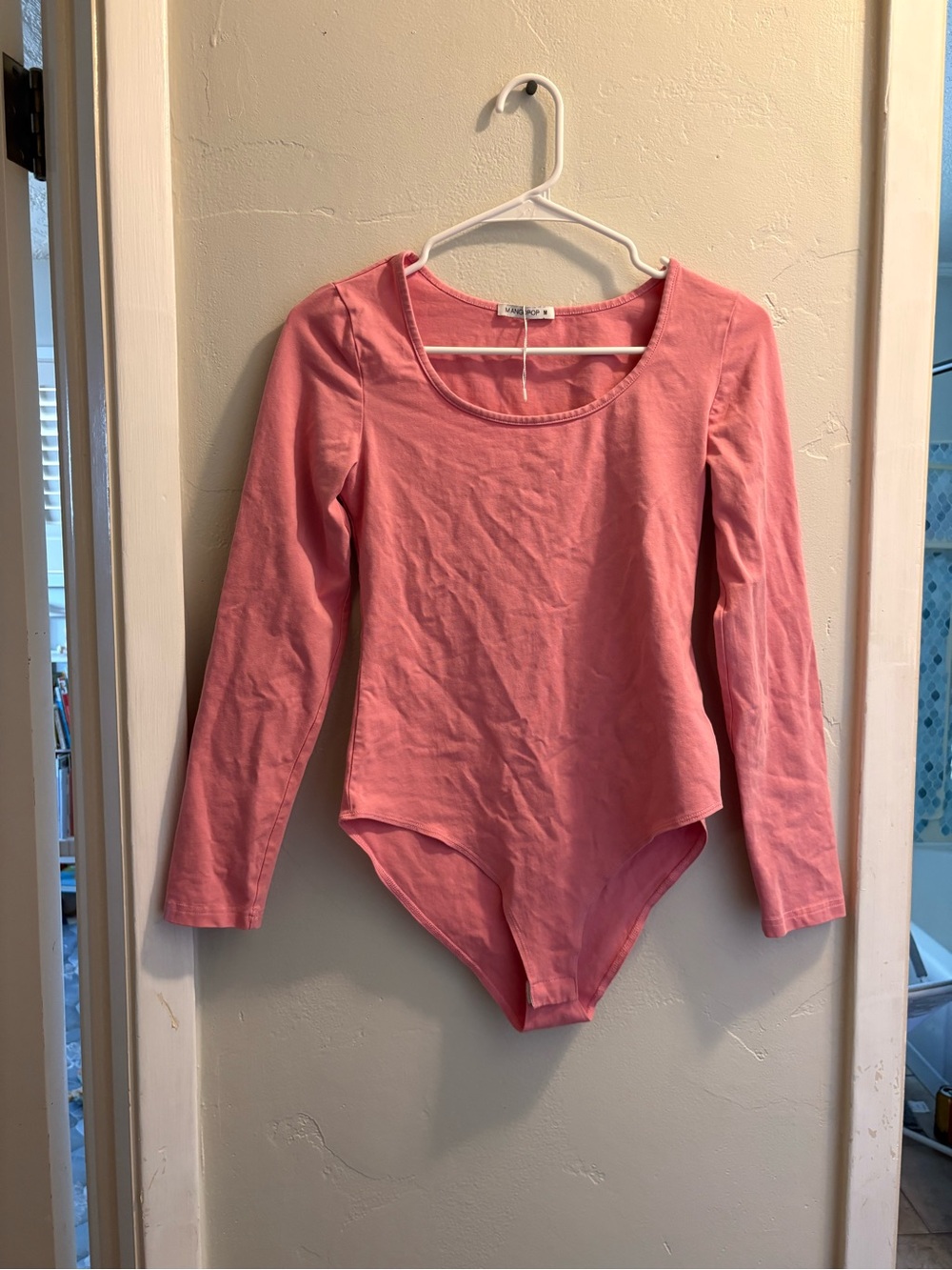 Soft pink long sleeve bodysuit